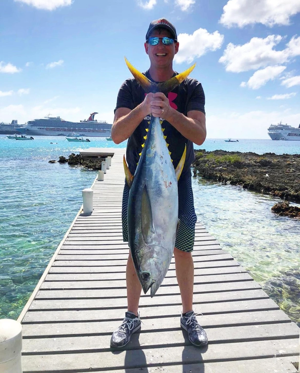 Guest with a great catch! boat rentals Grand Cayman George Town Grand Cayman  Contender 27 foot Open 2000 27 